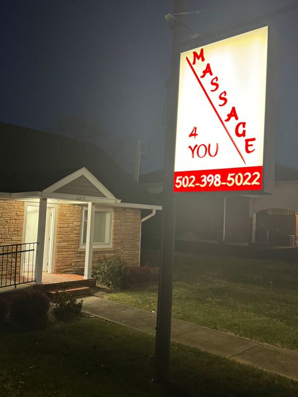 Picture of front of building with large sign. Massage 4 You in Louisville Kentucky Call 502-398-5022