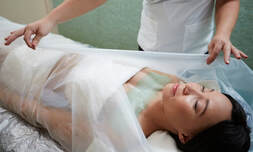 Picture of Lovely lady client receiving a Body Wrap treatment at   Tian Dao Massage in North Palm Beach, Florida USA