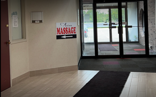 Picture of just inside the mall door, the GR Asian Massage sign and spa is there.
