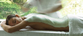 Lovely lady client receiving a Body Wrap treatment at   Tian Dao Massage in North Palm Beach, Florida USA